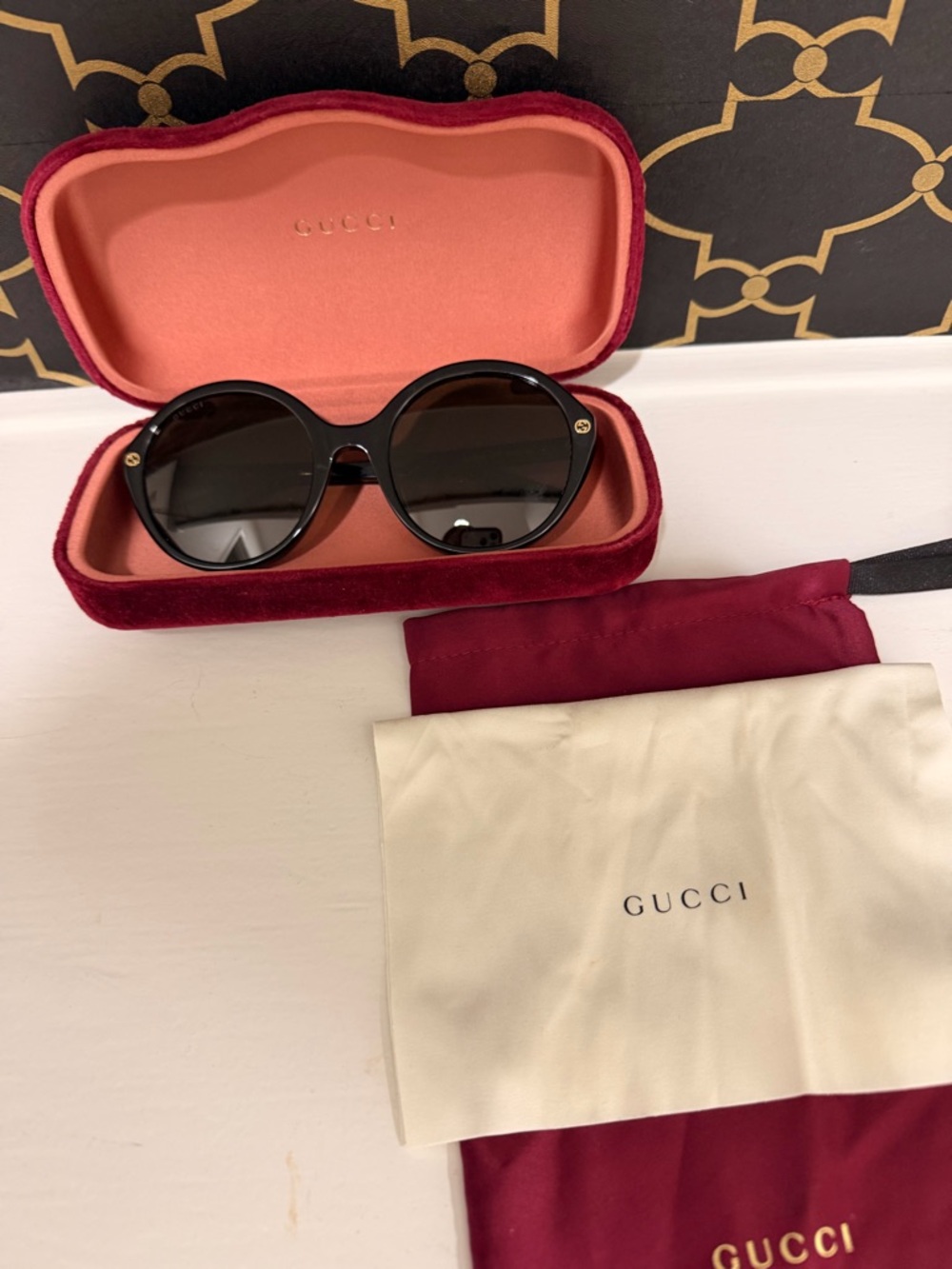 Gucci Black Round Sunglasses with Gold Details
